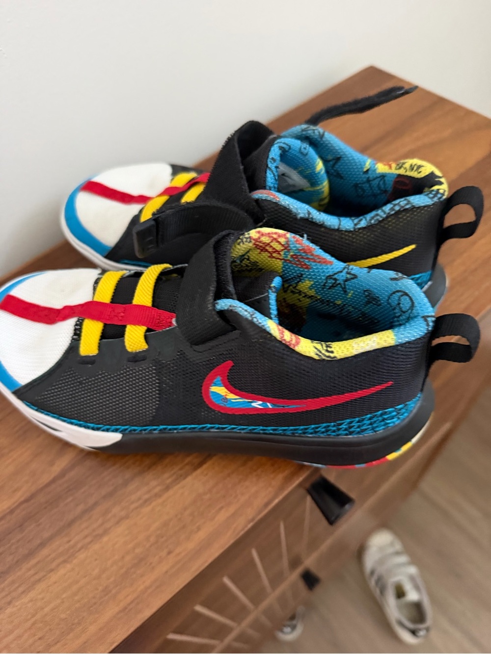 Nike Kids Black Sneakers with Red, Yellow & Blue Accents